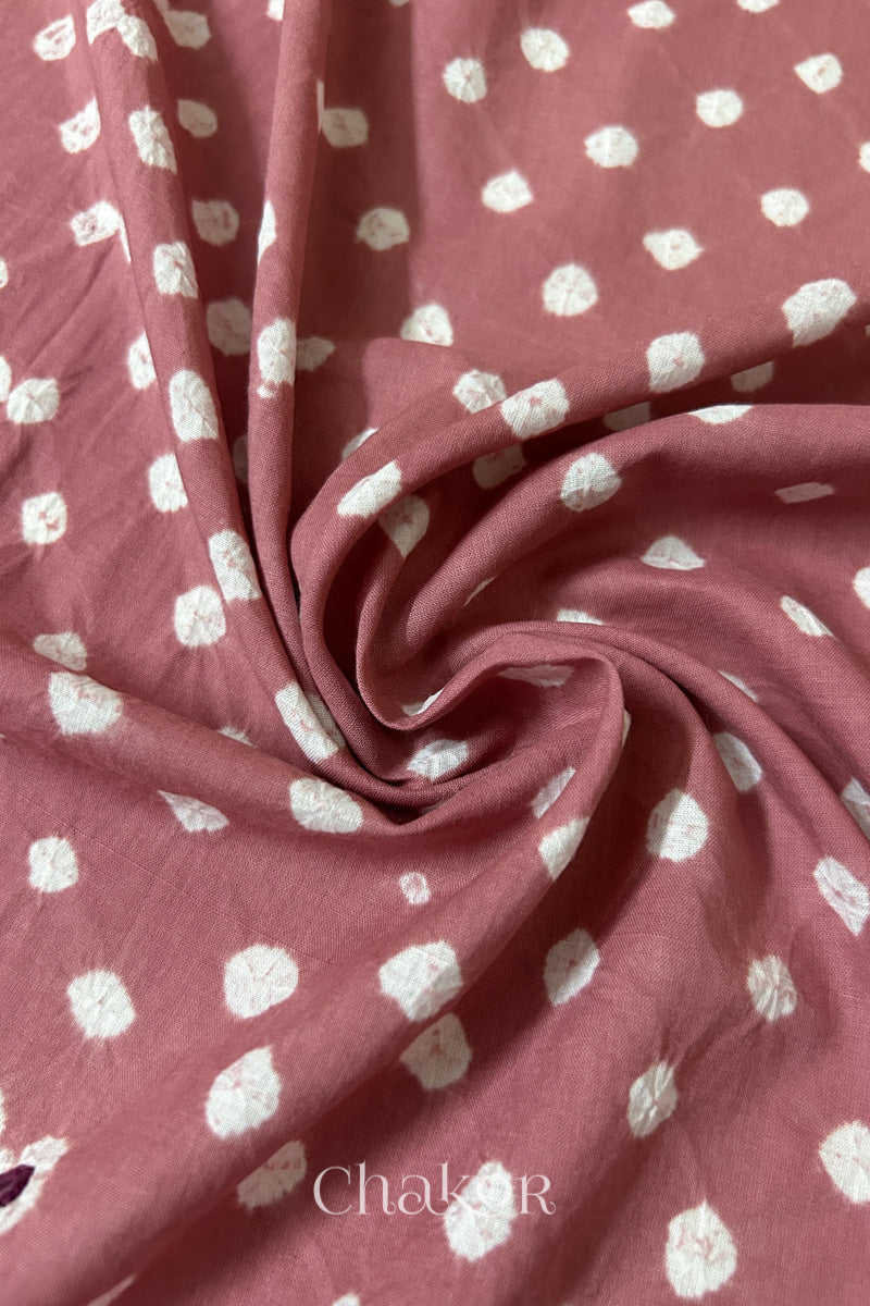 Old Rose Bandhani cotton blouse fabric showing fine tie-dye dots and its soft drape.
