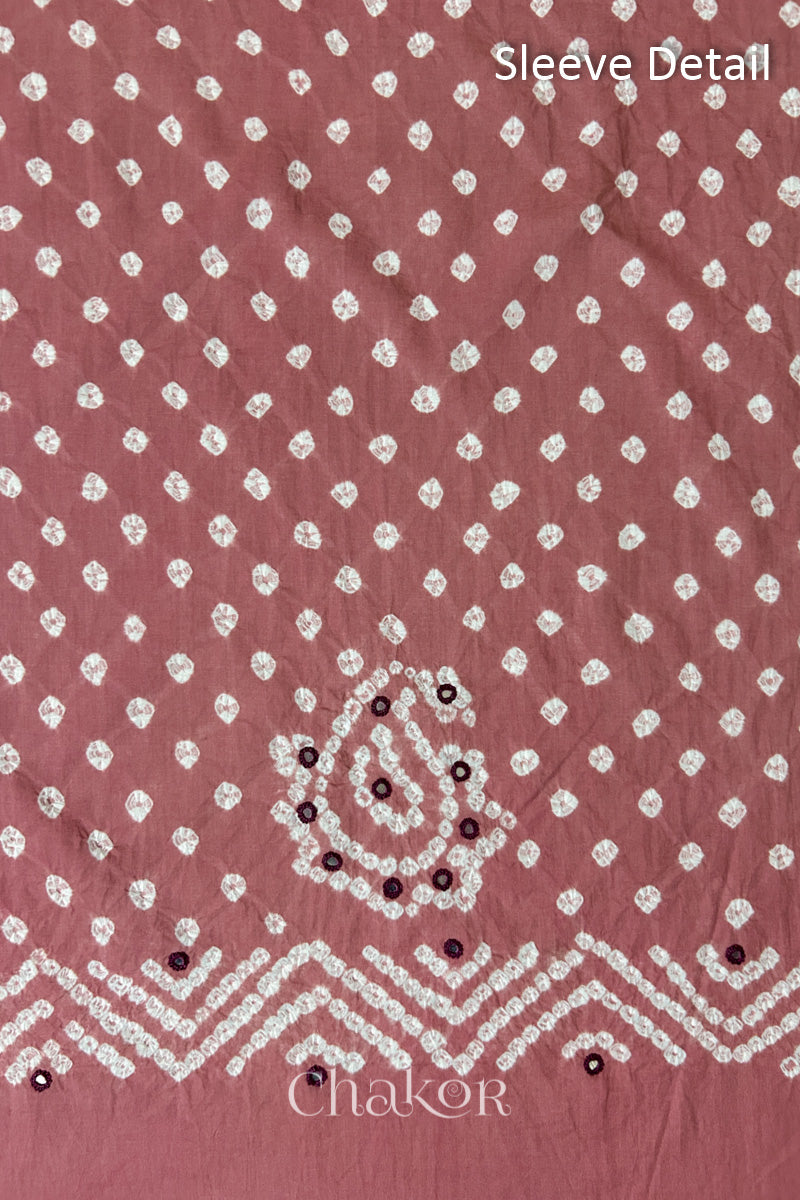 Old Rose Kutch Bandhani cotton fabric with white tie-dye dots and Keri motif detail for sleeves.
