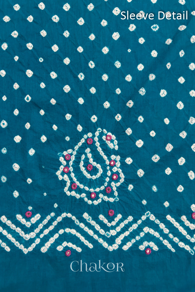 Turquoise Kutch Bandhani cotton fabric with white tie-dye dots and Keri motif detail for sleeves.
