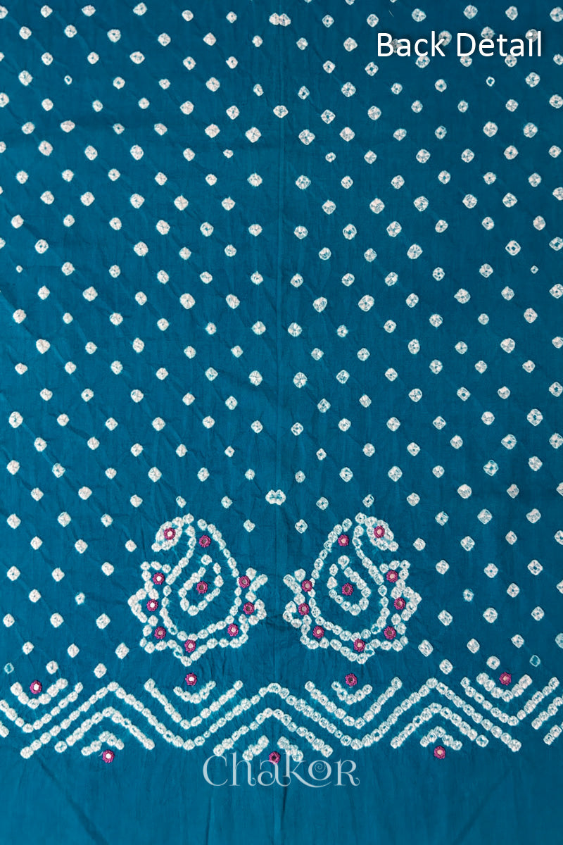 Close-up of Turquoise Kutch Bandhani fabric with white dotted pattern and Keri motifs for back.
