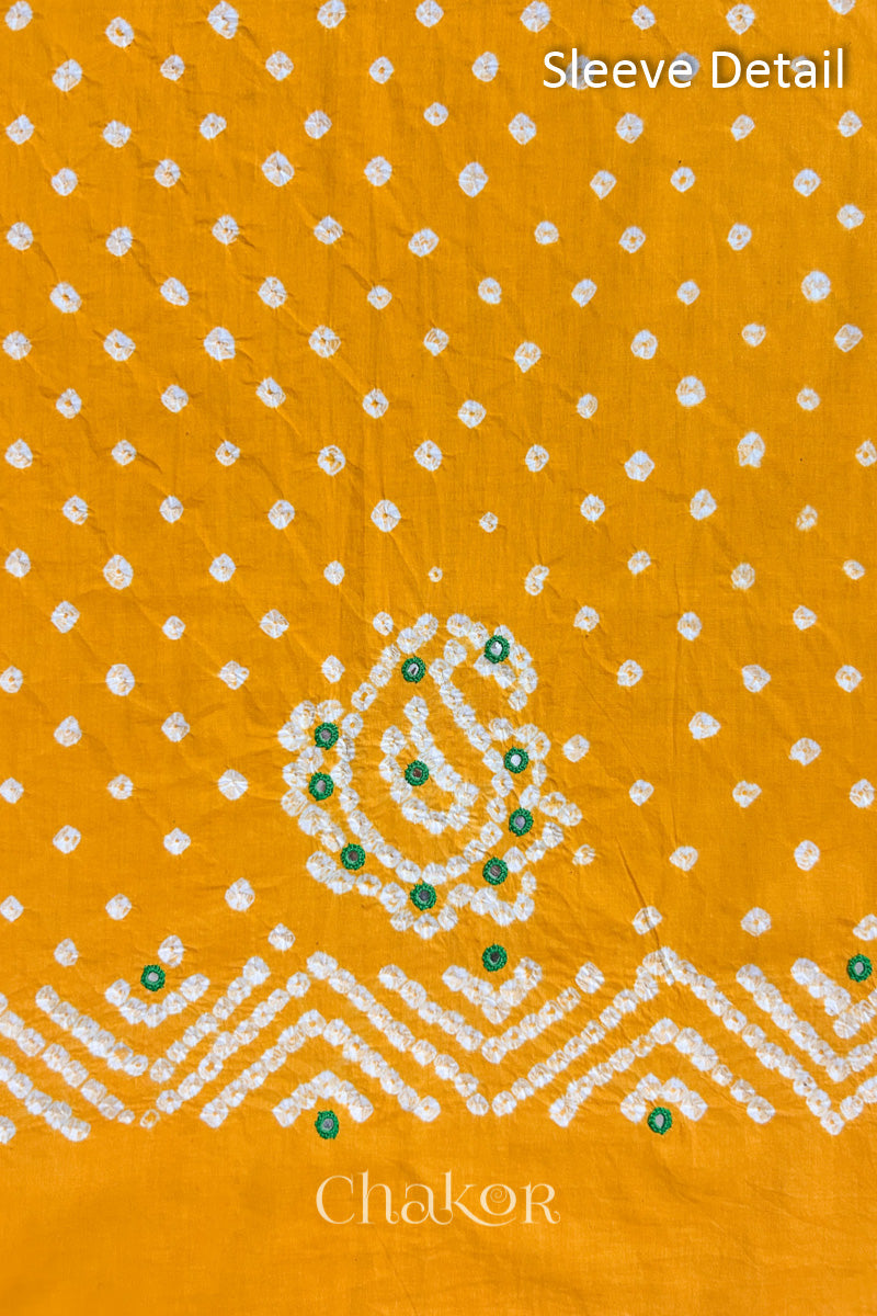 Yellow Kutch Bandhani cotton fabric with white tie-dye dots and Keri motif detail for sleeves.
