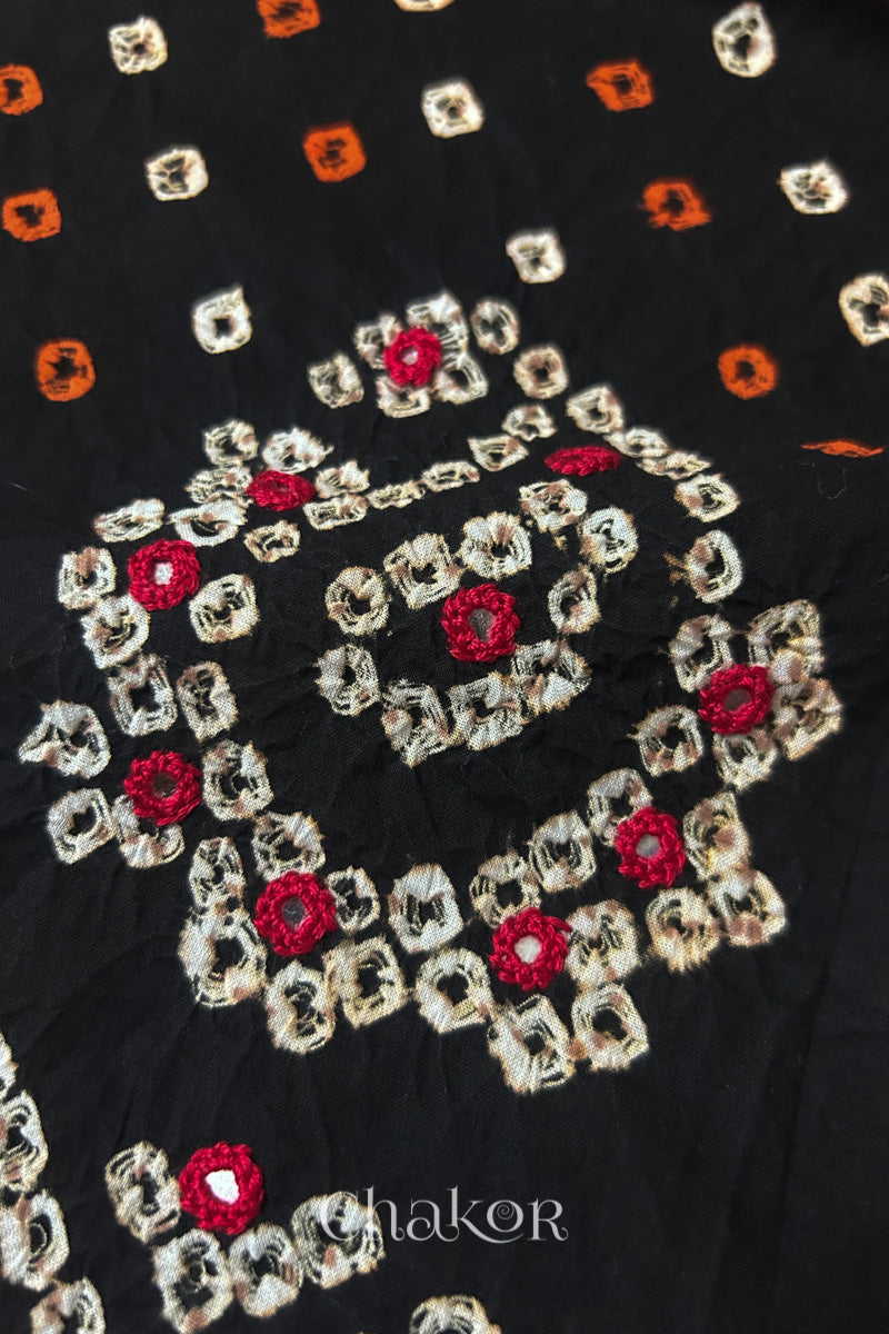 Close-up of Black Kutch Bandhani blouse fabric showing Keri motifs and hand-embroidered mirror work.
