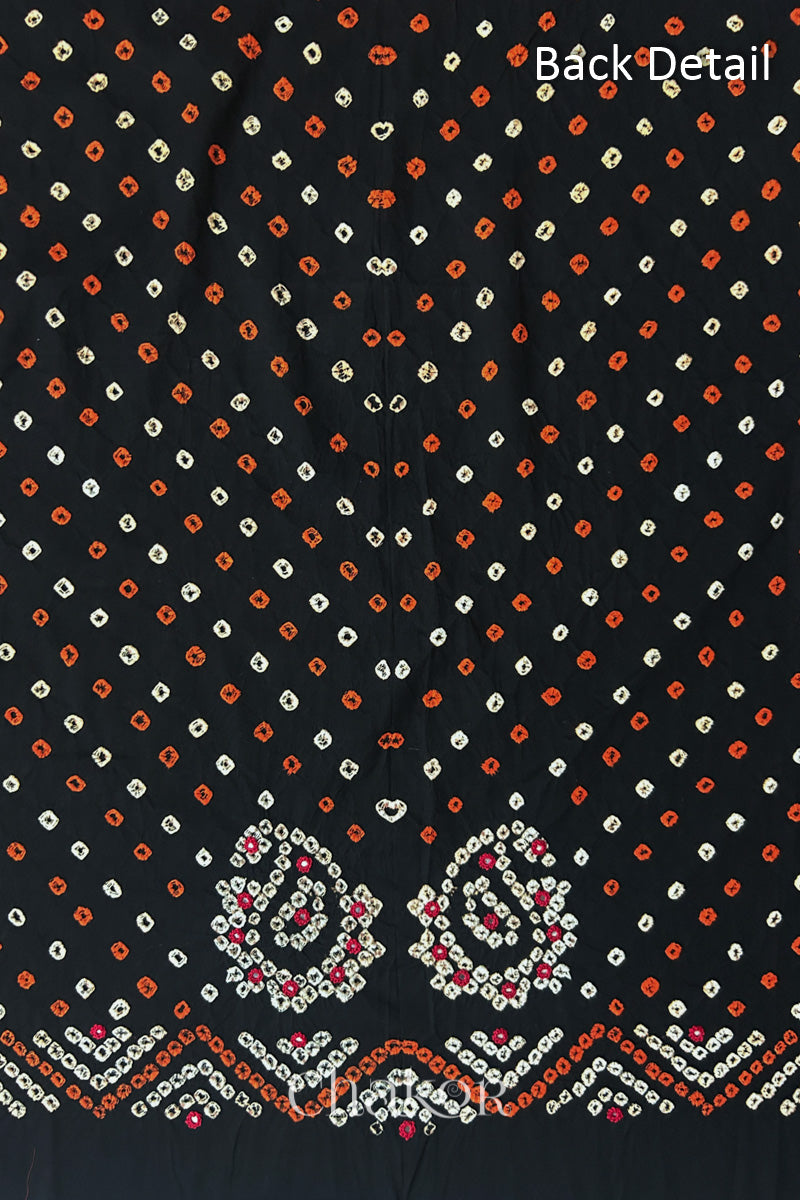 Close-up of Black Kutch Bandhani fabric with white dotted pattern and Keri motifs for back.
