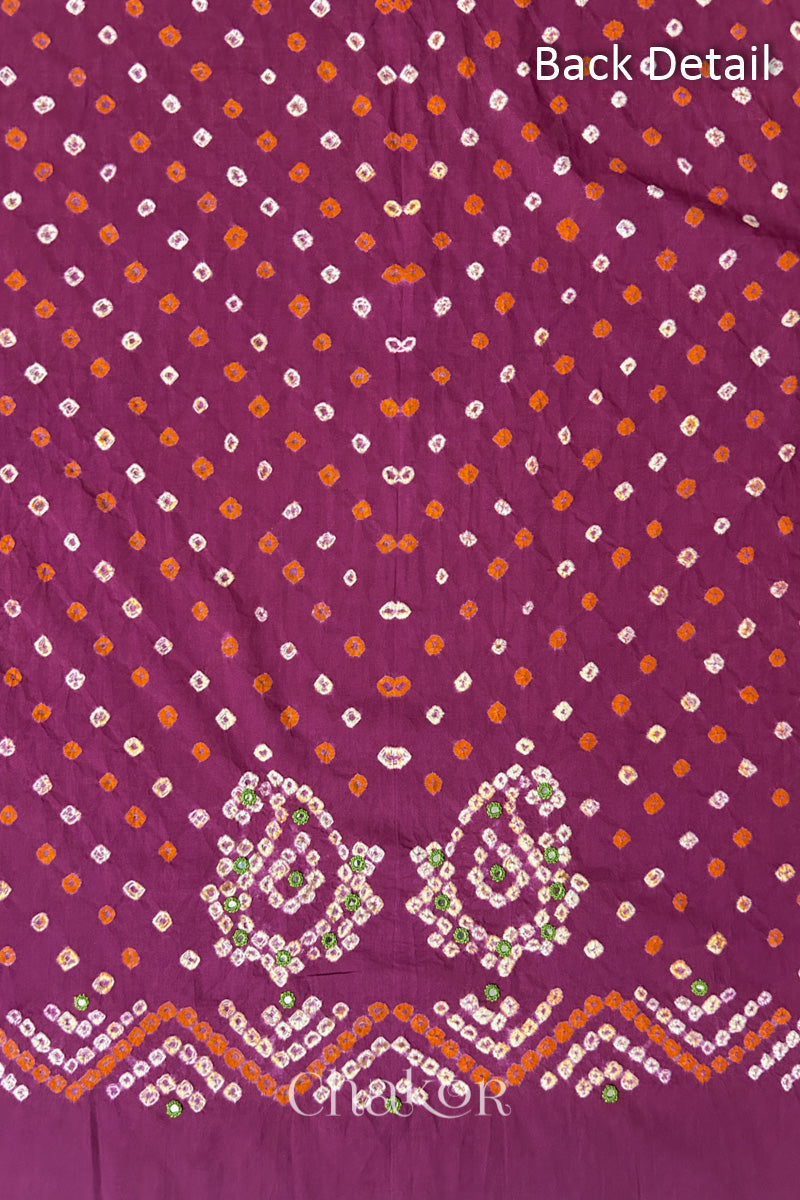 Close-up of Magenta Kutch Bandhani fabric with white dotted pattern and Keri motifs for back.
