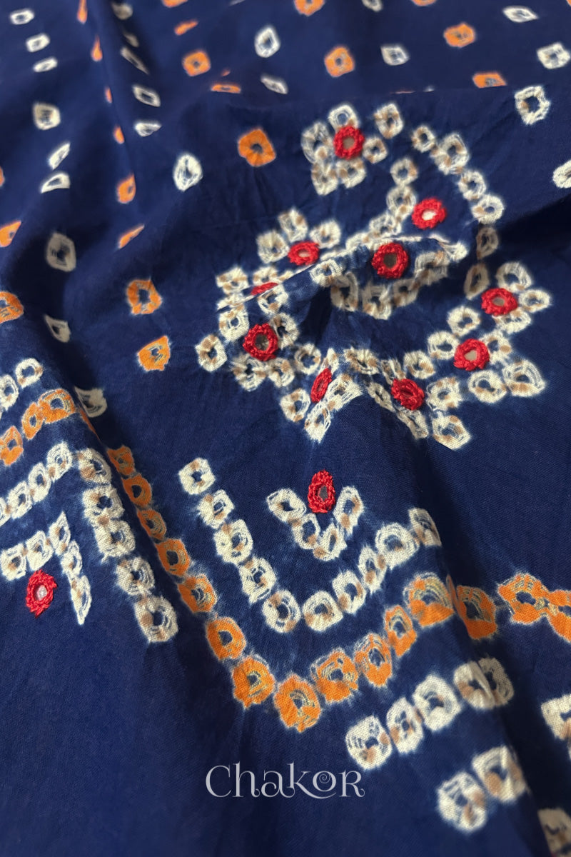 Detail of Kutch Bandhani Keri pattern with mirror embroidery on Navy cotton blouse fabric.
