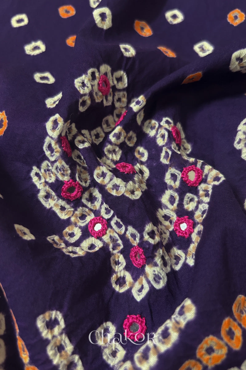 Close-up of Purple Kutch Bandhani blouse fabric showing Keri motifs and hand-embroidered mirror work.

