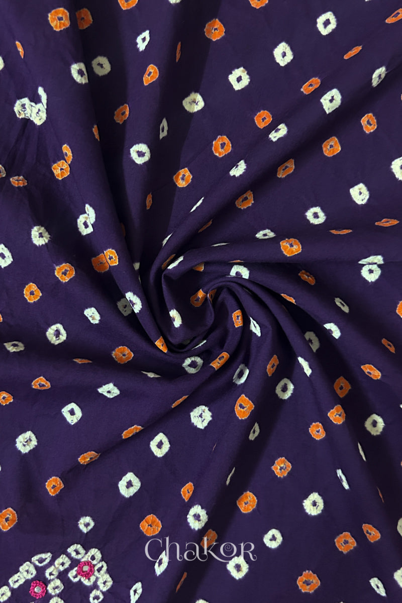 Purple Bandhani cotton blouse fabric showing fine tie-dye dots and its soft drape.
