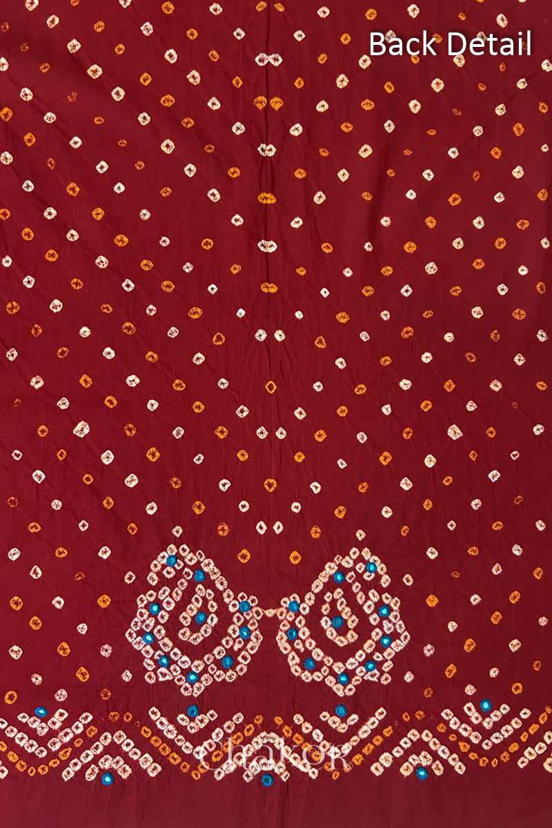 Close-up of Red Kutch Bandhani fabric with white dotted pattern and Keri motifs for back.
