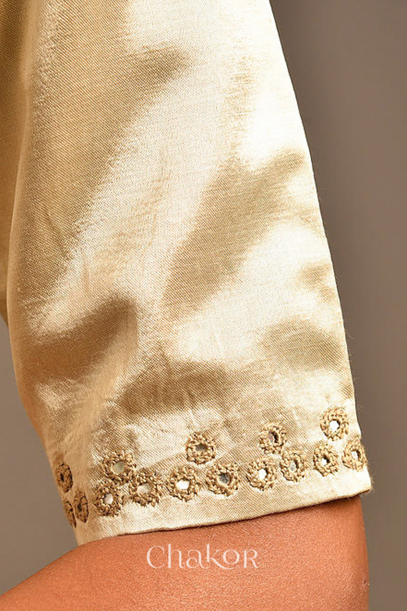 Woman wearing a handcrafted Silver Tan Mashru Silk Blouse with intricate mirror embroidery.