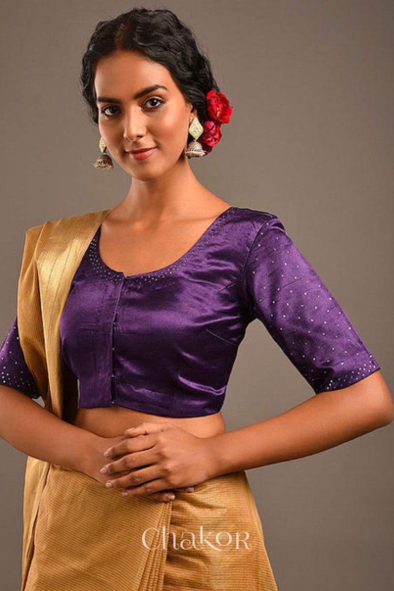 Woman wearing a handcrafted purple Mashru Silk Blouse with mukaish embroidery.