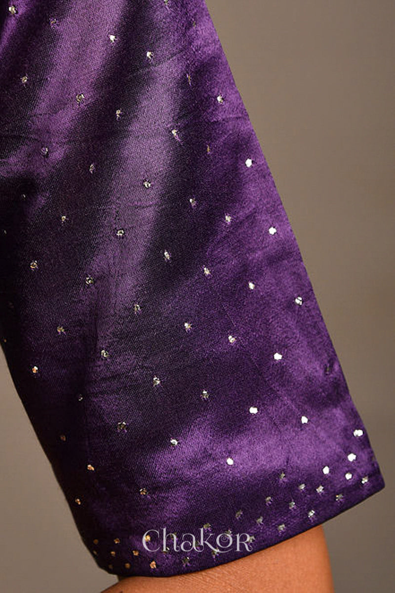 Woman wearing a handcrafted purple Mashru Silk Blouse with mukaish embroidery.