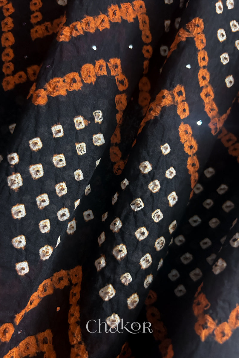 Close up of Traditional hand tied Bandhani pattern on Black mulmul cotton dupatta.
