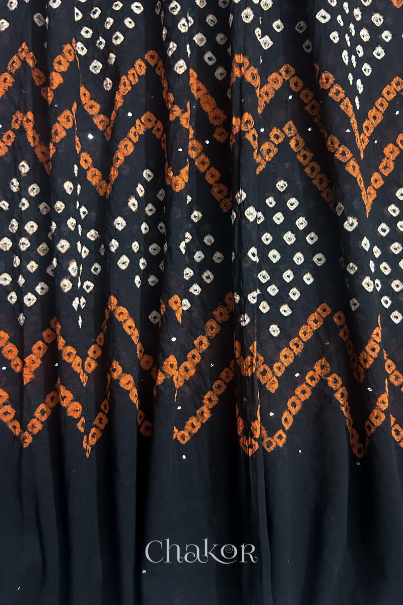 Detailed view of Bandhani tie-dye pattern and fabric fall on Black cotton dupatta.
