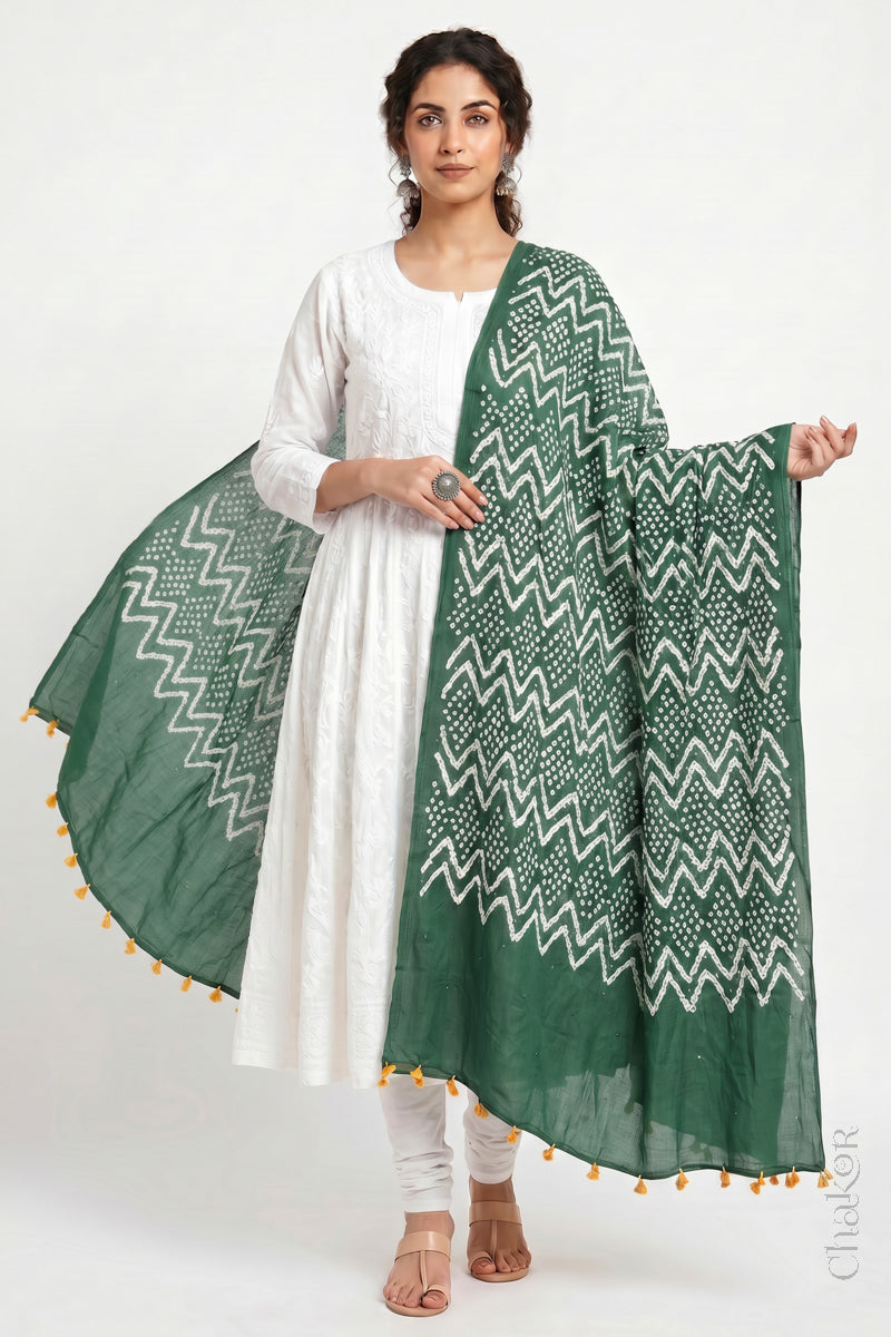 Moss green Kutch Bandhani dupatta with mukaish embroidery in mercerised mulmul cotton shown in side drape styling.
