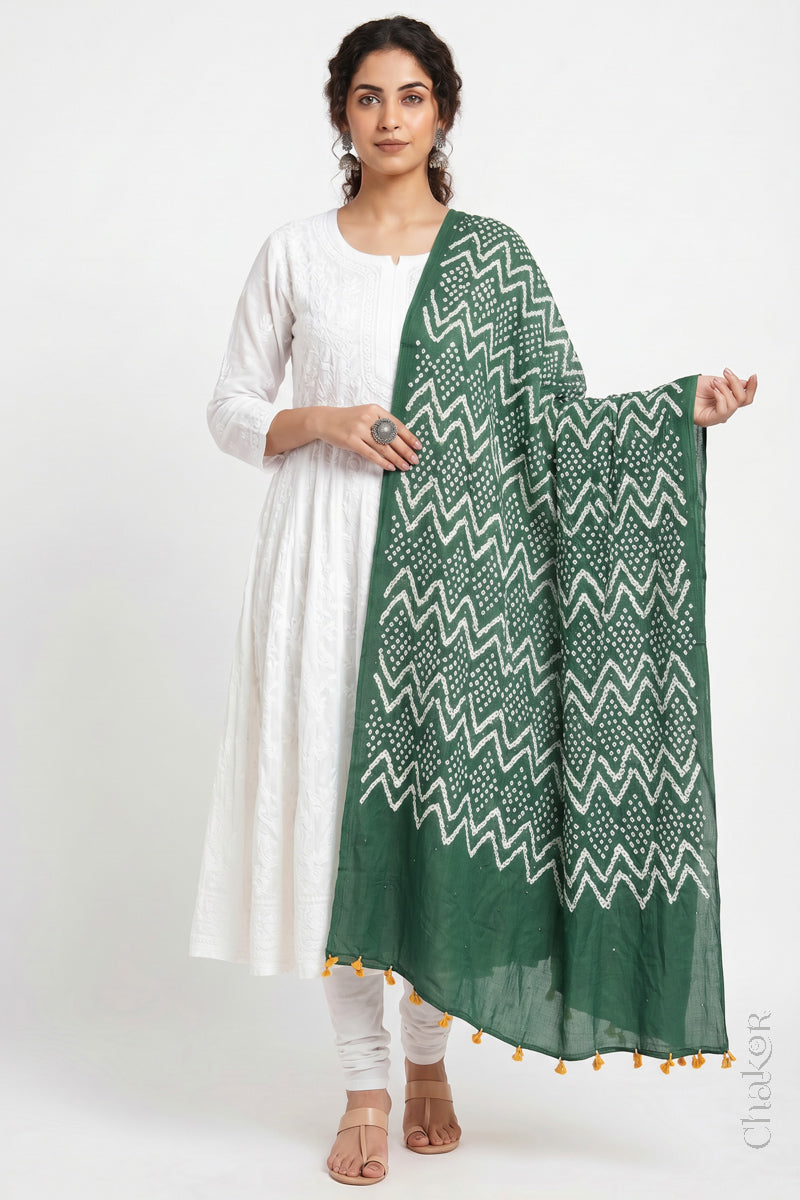 Moss green Kutch Bandhani dupatta with mukaish embroidery in lightweight mercerised mulmul cotton with flowing drape.
