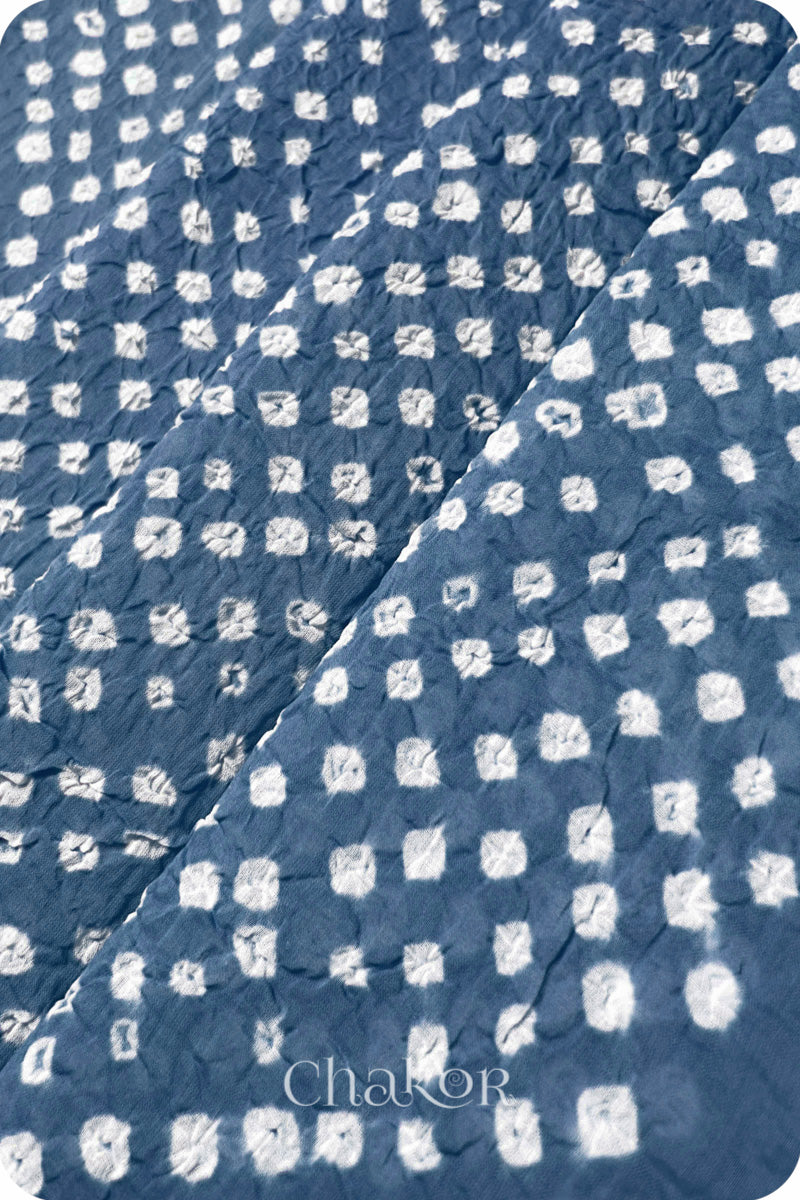 Chakor's blue grey cotton dupatta with white bandhani pattern, creating a stylish visual effect.

