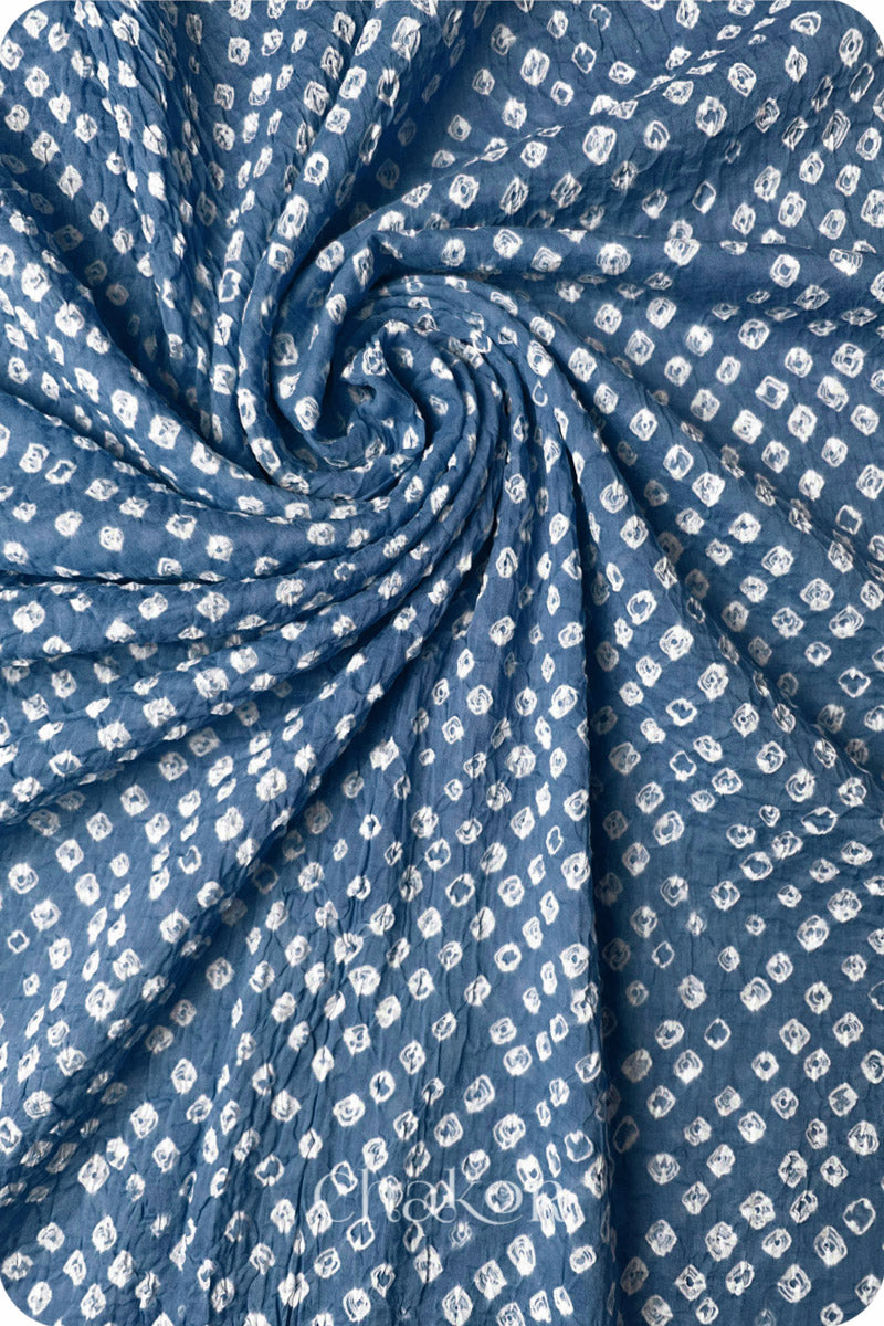 Chakor's blue grey cotton bandhani dupatta | chunri featuring white dots, arranged in a swirling design.

