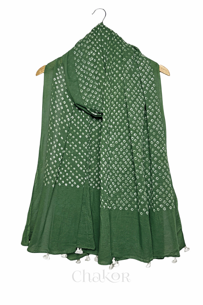 Moss green Bandhani mul cotton dupatta draped on hanger showing tie-dye dot pattern and tasselled edge.