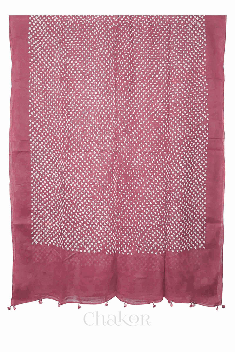 Full-length flat view of Old rose Bandhani mul cotton dupatta with all-over tie-dye pattern and tassels.