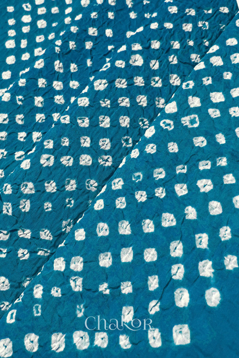 Close-up of Turquoise Bandhani tie-dye dot pattern on mul cotton dupatta.
