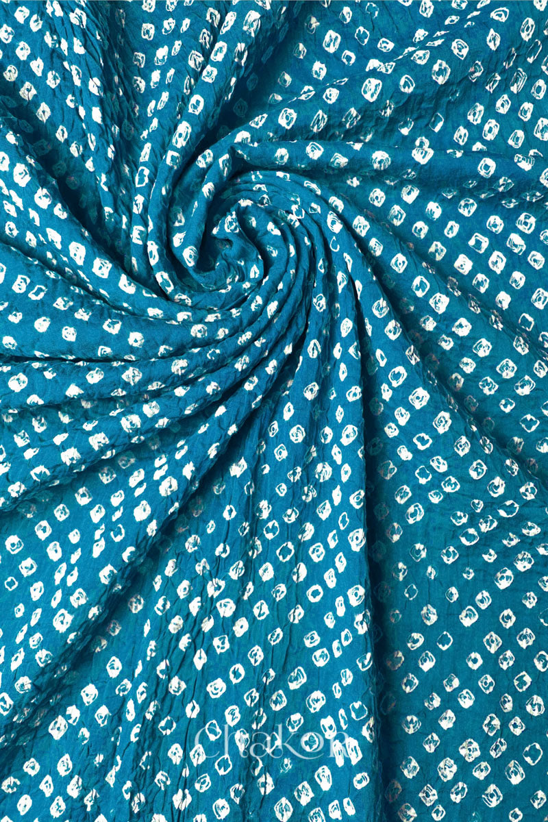 Detail view of Turquoise Bandhani mul cotton dupatta highlighting tie-dye dots arranged in spiral drape.
