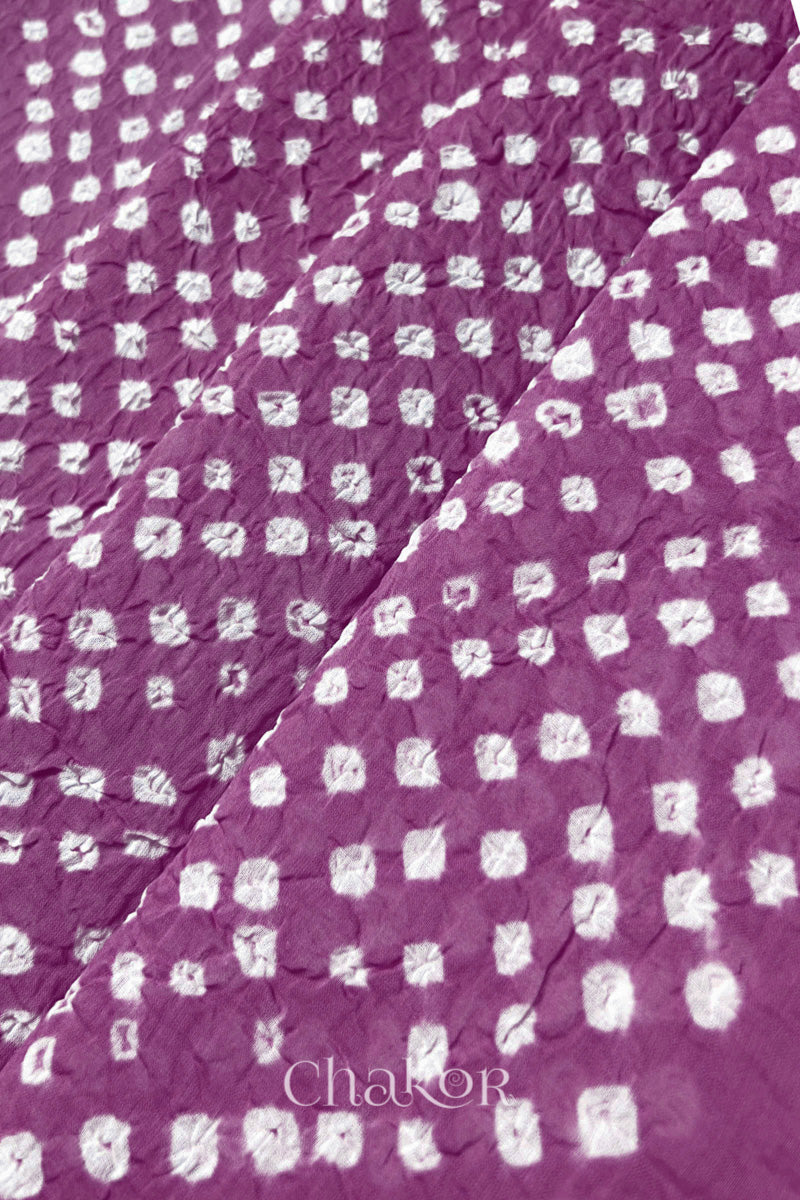 Close-up of Violet purple Bandhani tie-dye dot pattern on mul cotton dupatta.
