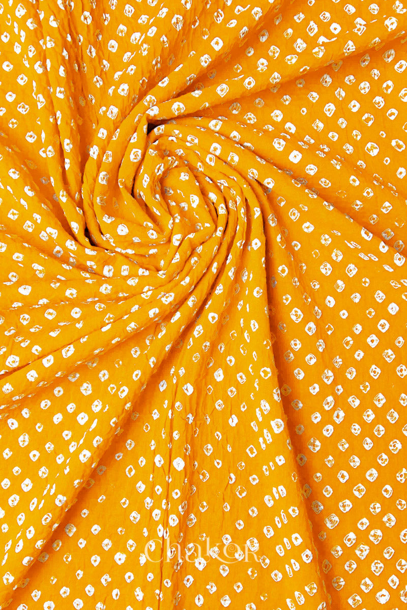 Detail view of Yellow Bandhani mul cotton dupatta highlighting tie-dye dots arranged in spiral drape