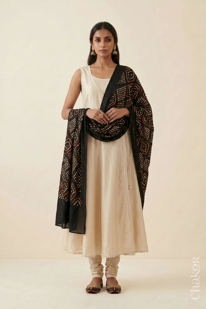 Black Bandhej dupatta in pure mulmul cotton worn with a neutral outfit.
