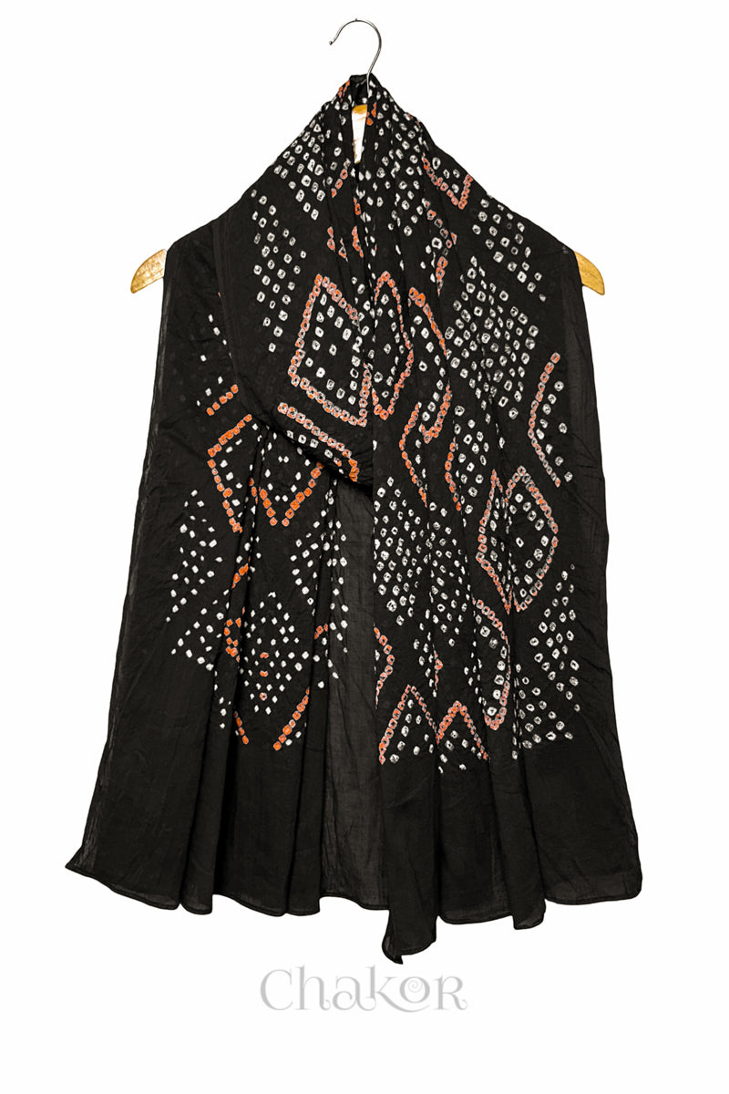 Full length view of handmade Kutch Bandhani dupatta in Black mulmul cotton.
