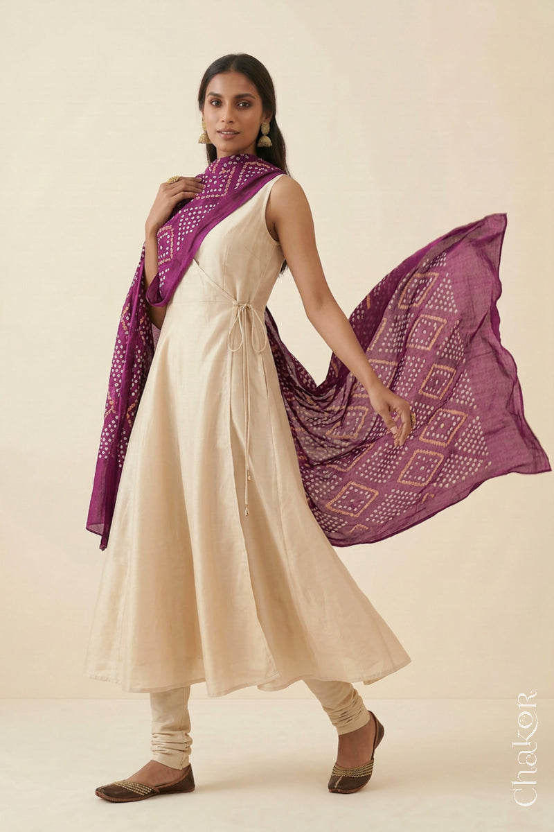 Magenta handmade Bandhani mulmul cotton dupatta shown in flowing drape.
