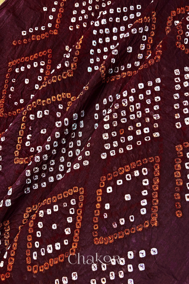 Traditional Chorkat Bandhani pattern with dense hand tied dots on maroon cotton dupatta.

