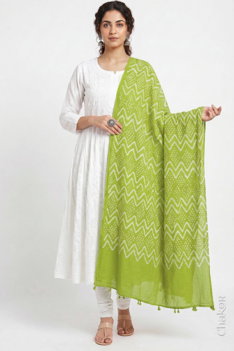 Lime Green Kutch Bandhani dupatta in lightweight mercerised mulmul cotton with flowing drape.
