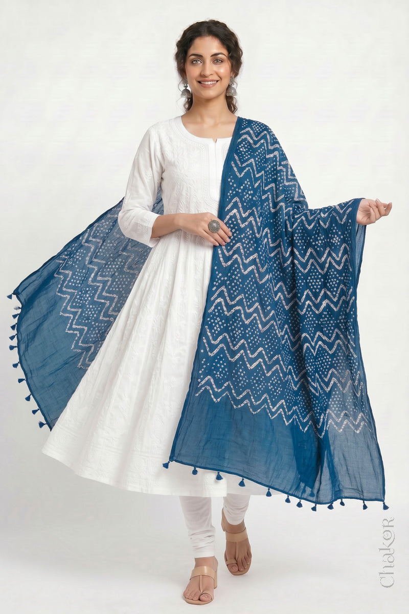 Indigo Blue Kutch Bandhani dupatta in mercerised mulmul cotton shown in side drape styling.
