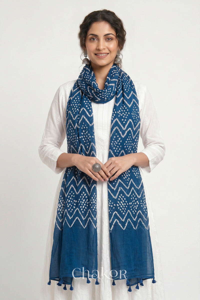 Hand tied Indigo Blue Kutch Bandhani dupatta in pure mercerised mulmul cotton worn by model.
