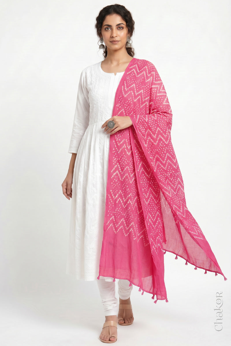 Pink Kutch Bandhani dupatta in mercerised mulmul cotton shown in side drape styling.
