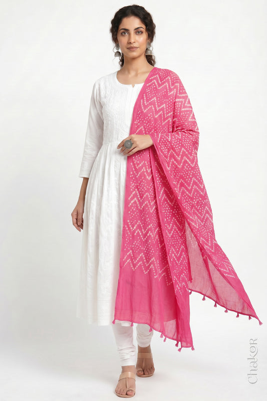 Pink Kutch Bandhani dupatta in mercerised mulmul cotton shown in side drape styling.

