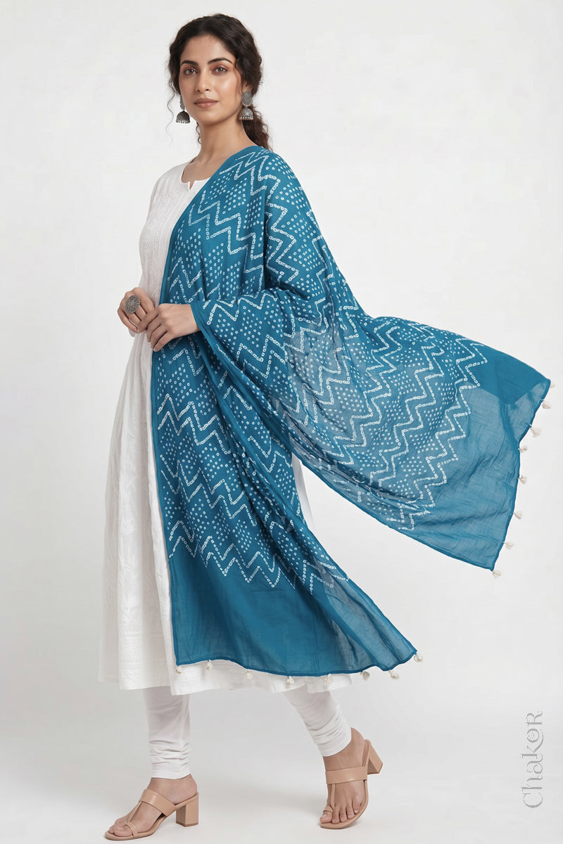 Turquoise Blue Kutch Bandhani dupatta in mercerised mulmul cotton shown in side drape styling.