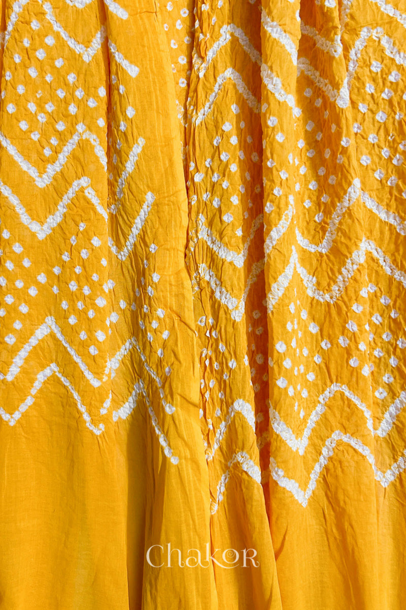 Detailed view of Bandhani tie-dye pattern and fabric fall on Yellow cotton dupatta.
