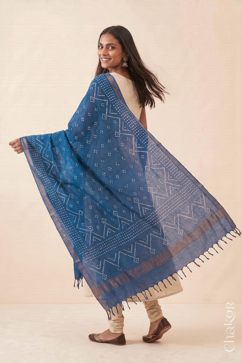 Indigo Blue Bandhani handloom Mangalgiri cotton dupatta worn by a woman, shown in motion.
