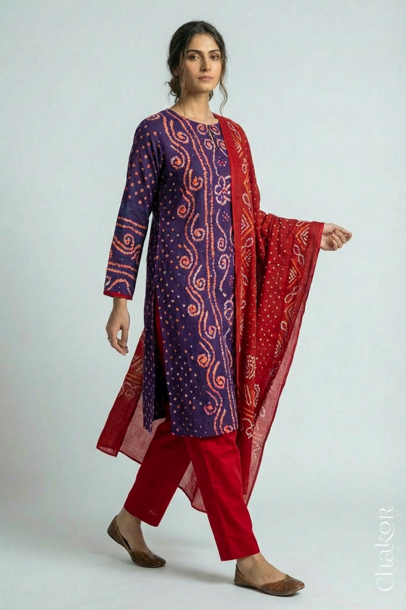 Model wearing Purple Bandhani Cotton Tunic with Red Pant with Dupatta, Handcrafted in Kutch with traditional design and hand embroidery.