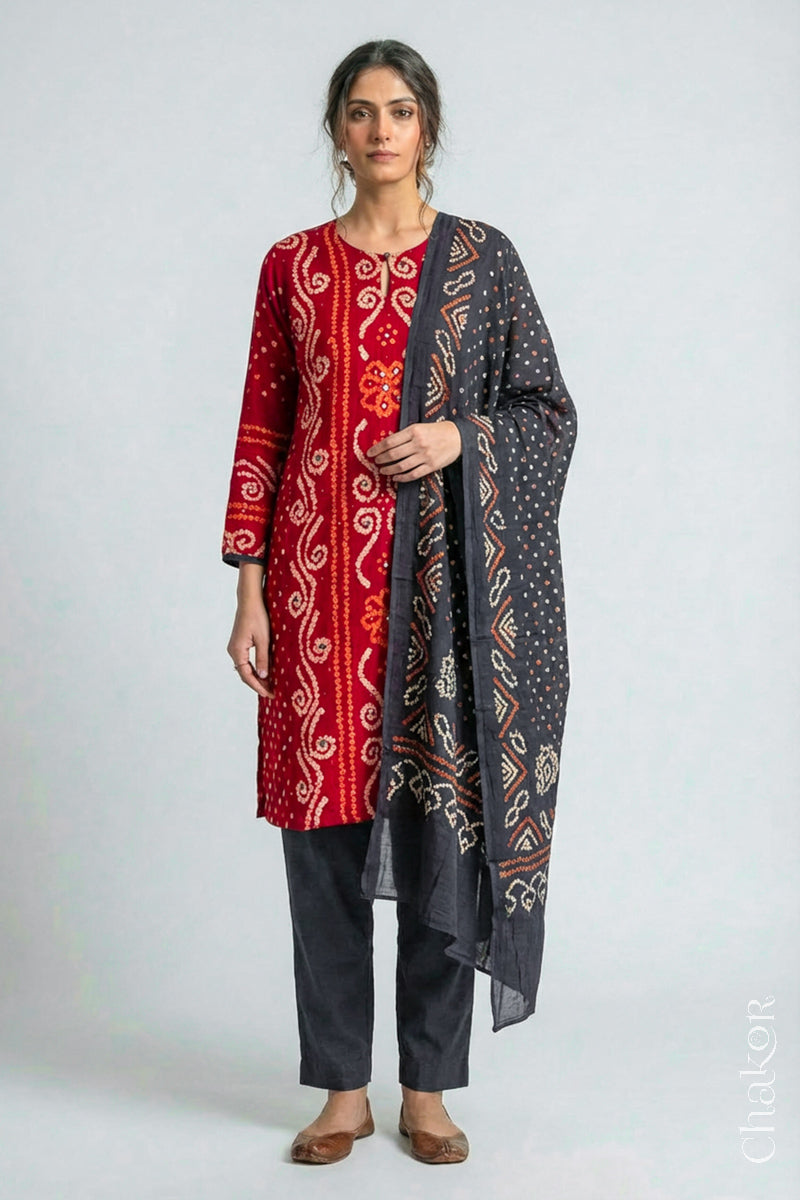 Model wearing Red Bandhani Cotton Tunic with Charcoal gray Pant with Dupatta, Handcrafted in Kutch with traditional design and hand embroidery.