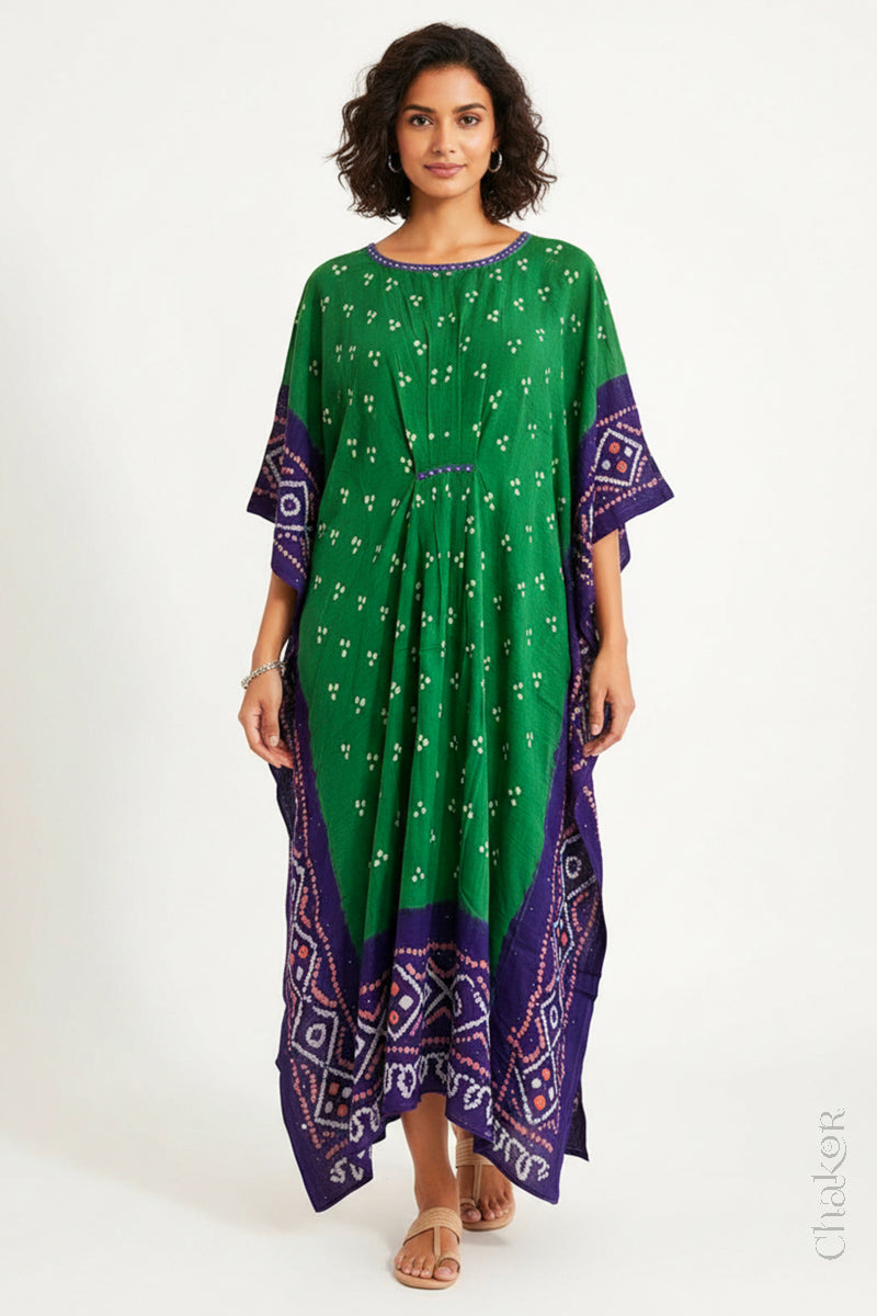 Handcrafted Kutch bandhani kaftan dress in breathable mulmul cotton with mirror & mukaish work.
