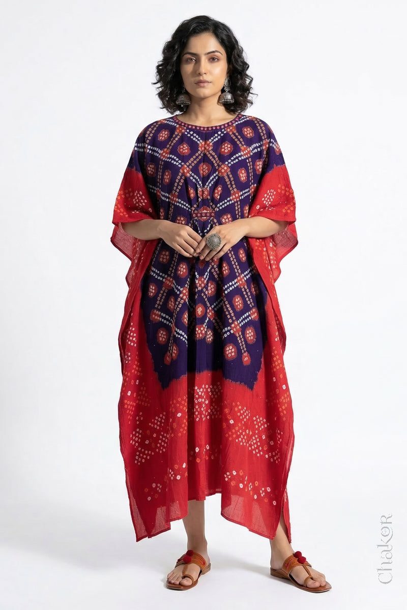 Handcrafted Kutch bandhani kaftan dress in breathable mulmul cotton with mirror & mukaish work.
