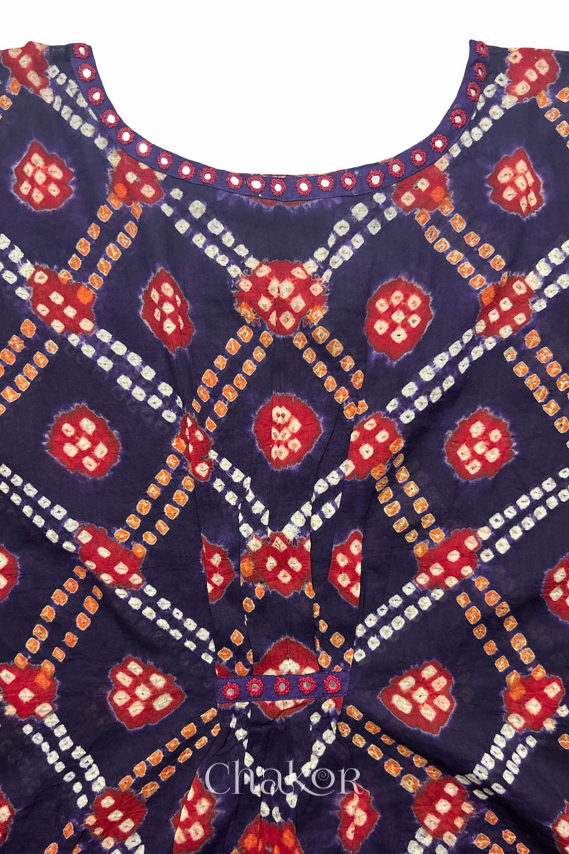 Kutch Bandhani pattern with mirror neckline detail on handcrafted cotton mulmul kaftan dress.

