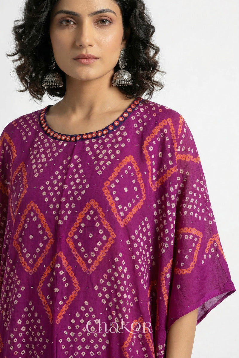 Bandhani kaftan neckline with mirror work detail in magenta mulmul cotton for summer.
