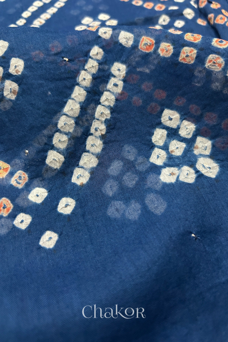 Mulmul cotton bandhani fabric with mukaish embroidery detail in indigo.
