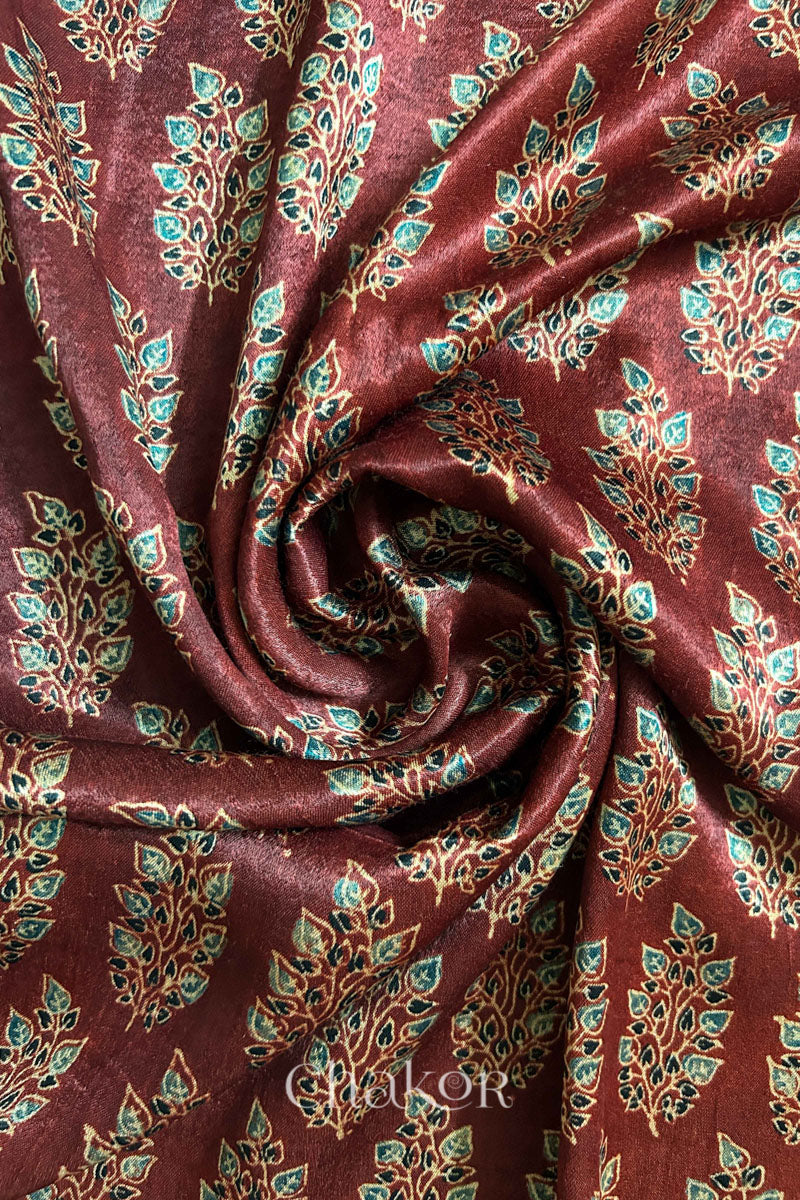 Close up of madder red ajrakh block printed mashru silk kurta fabric.