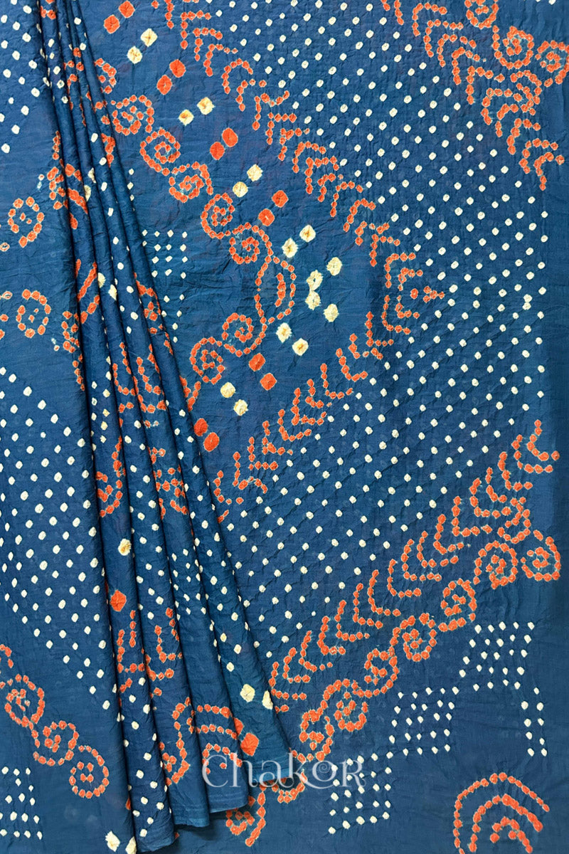Profile Image: Handmade Bandhani Cotton Saree with Soft Orange and White Dots in Earthy Indgio Blue by Chakor.
