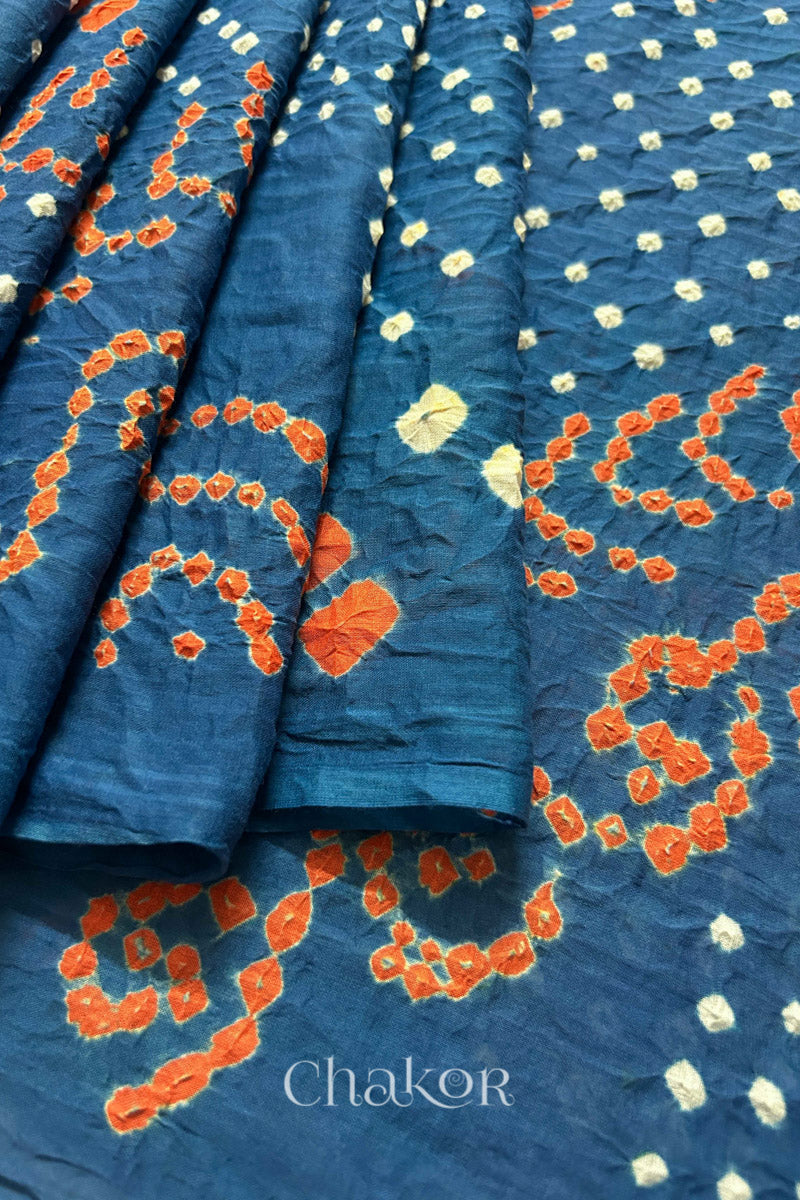 Close up: Handmade Bandhani Cotton Saree with Soft Orange and White Dots in Earthy Indgio Blue by Chakor.