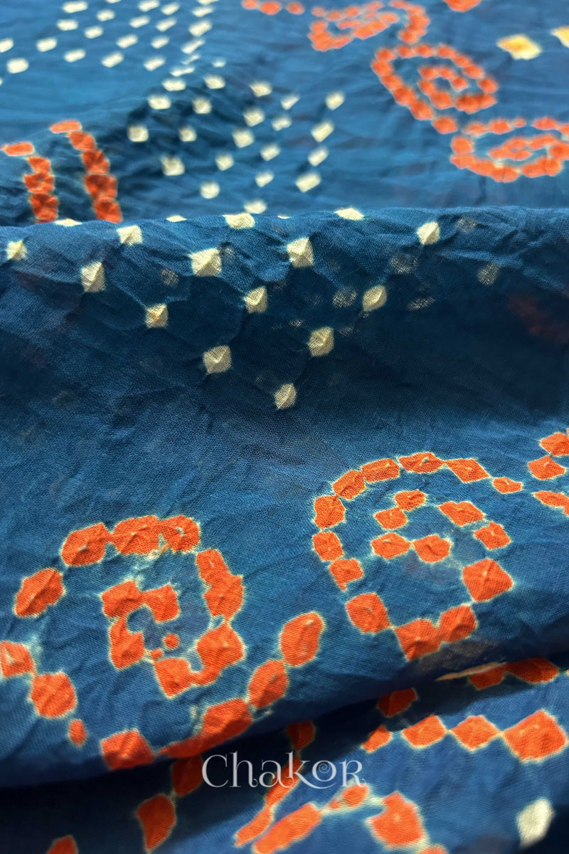 Close up: Handmade Bandhani Cotton Saree with Soft Orange and White Dots in Earthy Indgio Blue by Chakor.